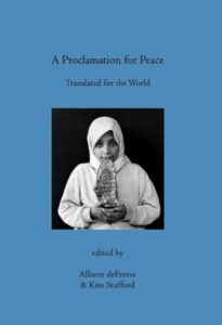 Blue book of poetry with black and white photo of girl