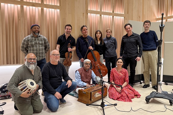 Photo of musicians in performance hall with wood walls