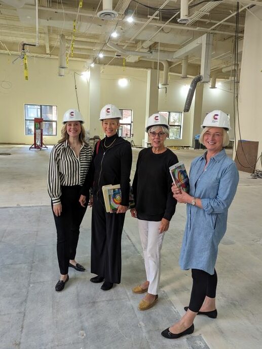 Group of four people standing in construction site