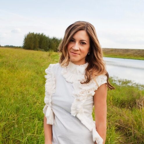 Photo of Naomi LaViolette standing in grassy field