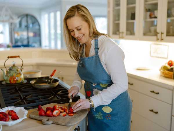 Suzanne Nance chopping strawberries