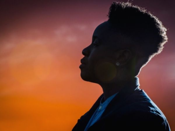 Chari Glogovac-Smith profile photo with a sunset