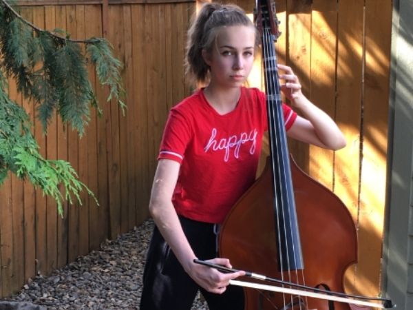 Raquel Armendariz standing outside with her Bass